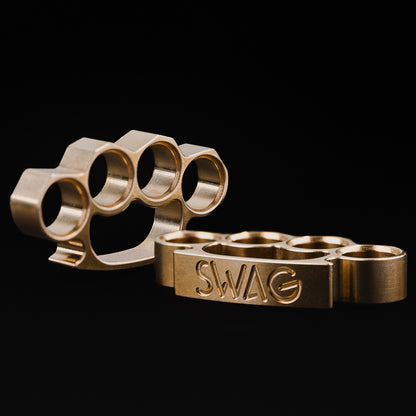 Brass SWAG knuckles golf ball marker.