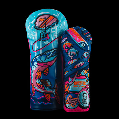 Front view of a colorful driver and fairway golf headcovers with ice fishing themed graphics, fish illustration, tackle box pattern, and SWAG branding.