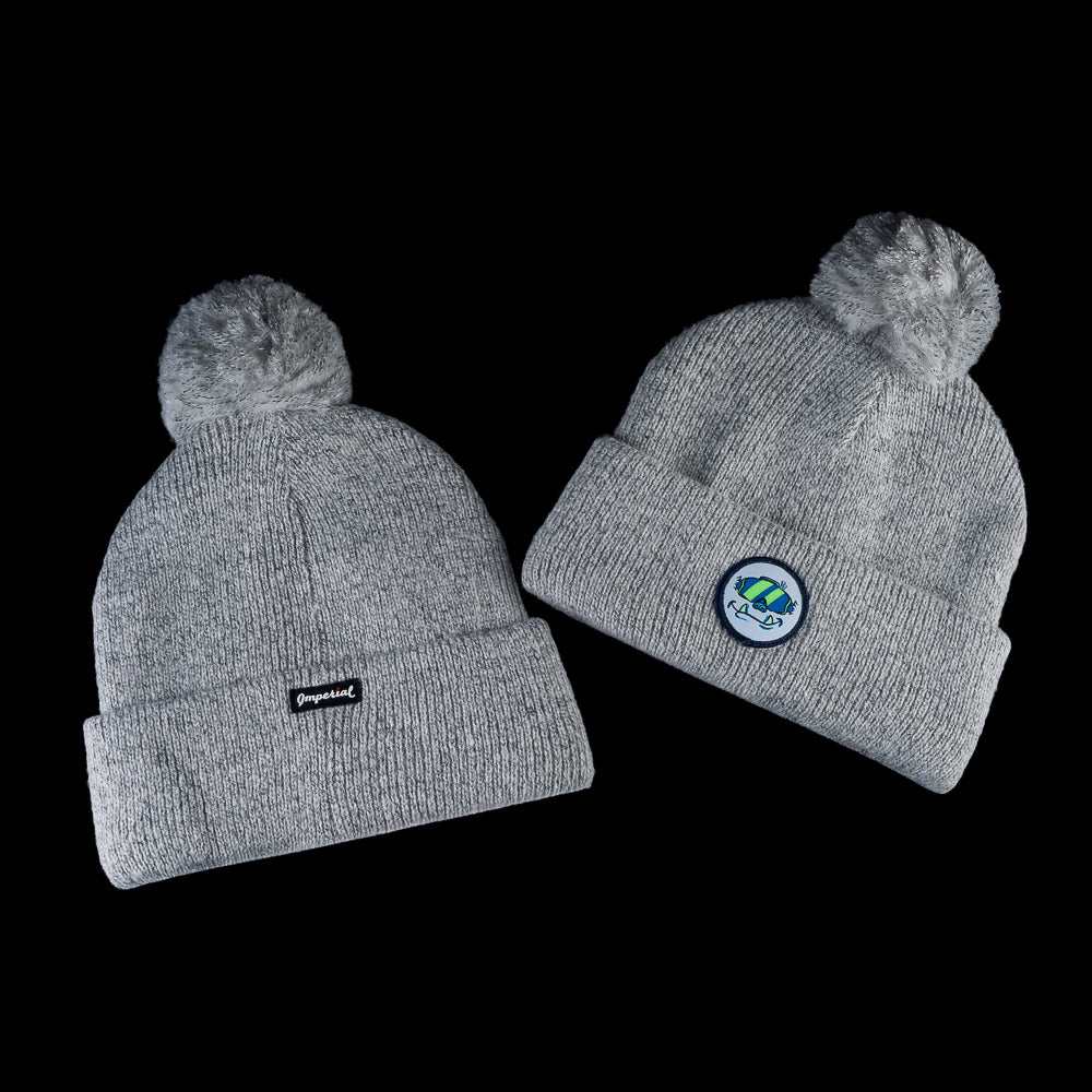 Light grey knit golf beanie with pom and No Offszn patch on front.