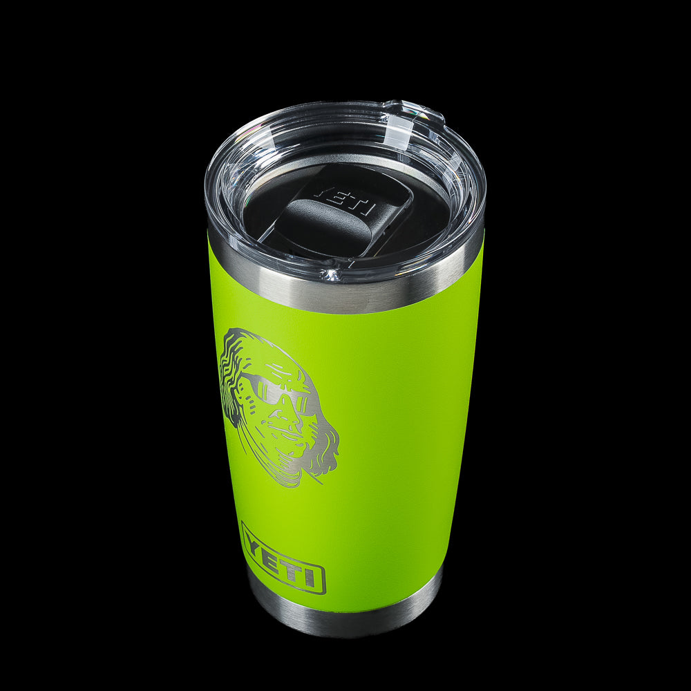 Angled view of the SWAG Golf x YETI Rambler 20 oz tumbler with MagSlider lid, Venom Green finish, and Benjamin Franklin graphic wearing sunglasses.
