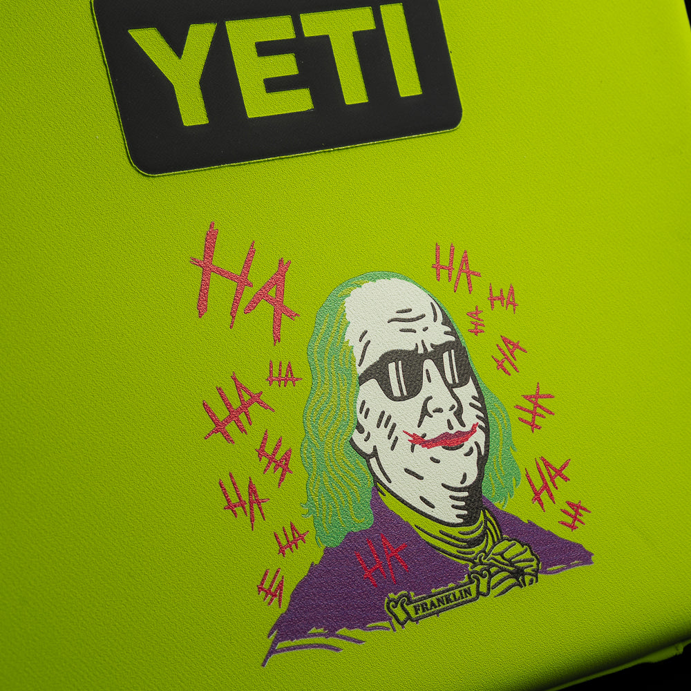 Close-up of the SWAG Golf x YETI Daytrip 3L lunch box showcasing the Defaced Franklin artwork on the front panel under the YETI logo.