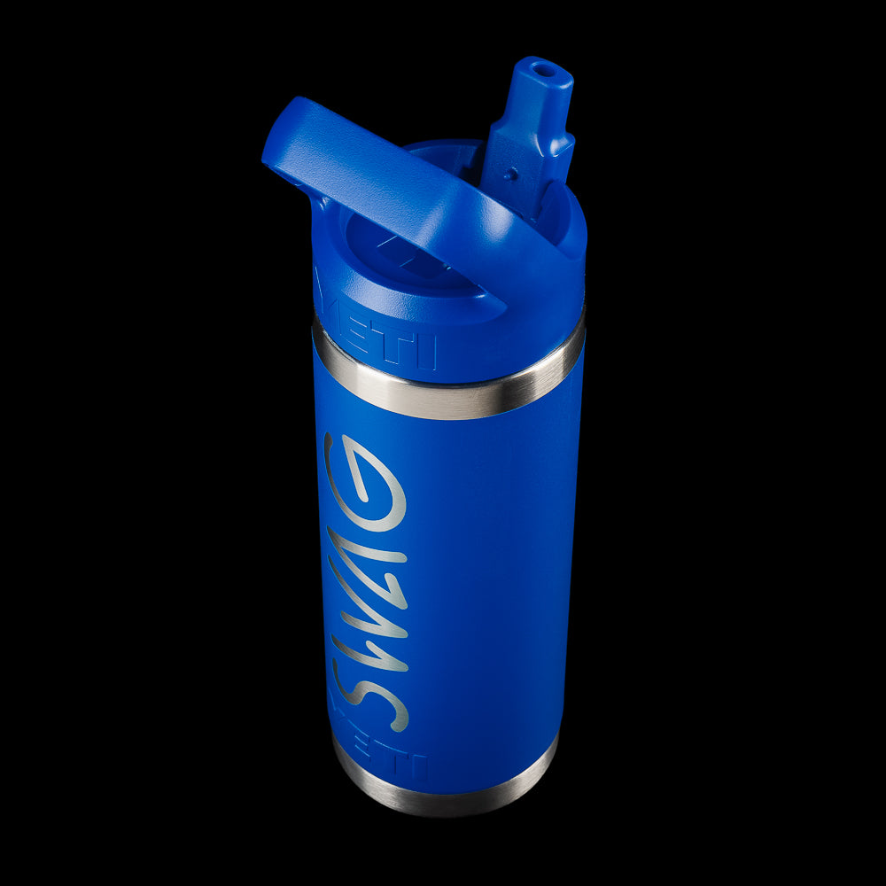 Angled view of the SWAG Golf x YETI Rambler 18 oz bottle with a straw lid, blue finish, and vertical SWAG logo.