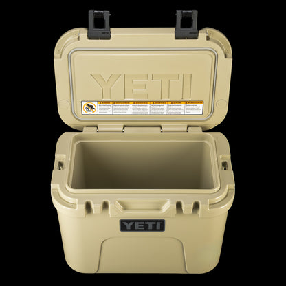 SWAG Golf x YETI hard cooler shown open to reveal the insulated interior and YETI branded lid.
