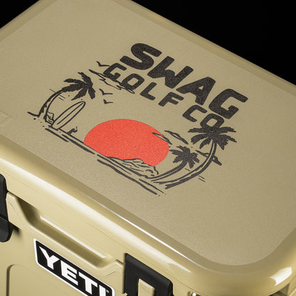 Close-up of the SWAG Golf x YETI cooler lid featuring the exclusive SWAG Golf palm tree logo with a bold red sun graphic.