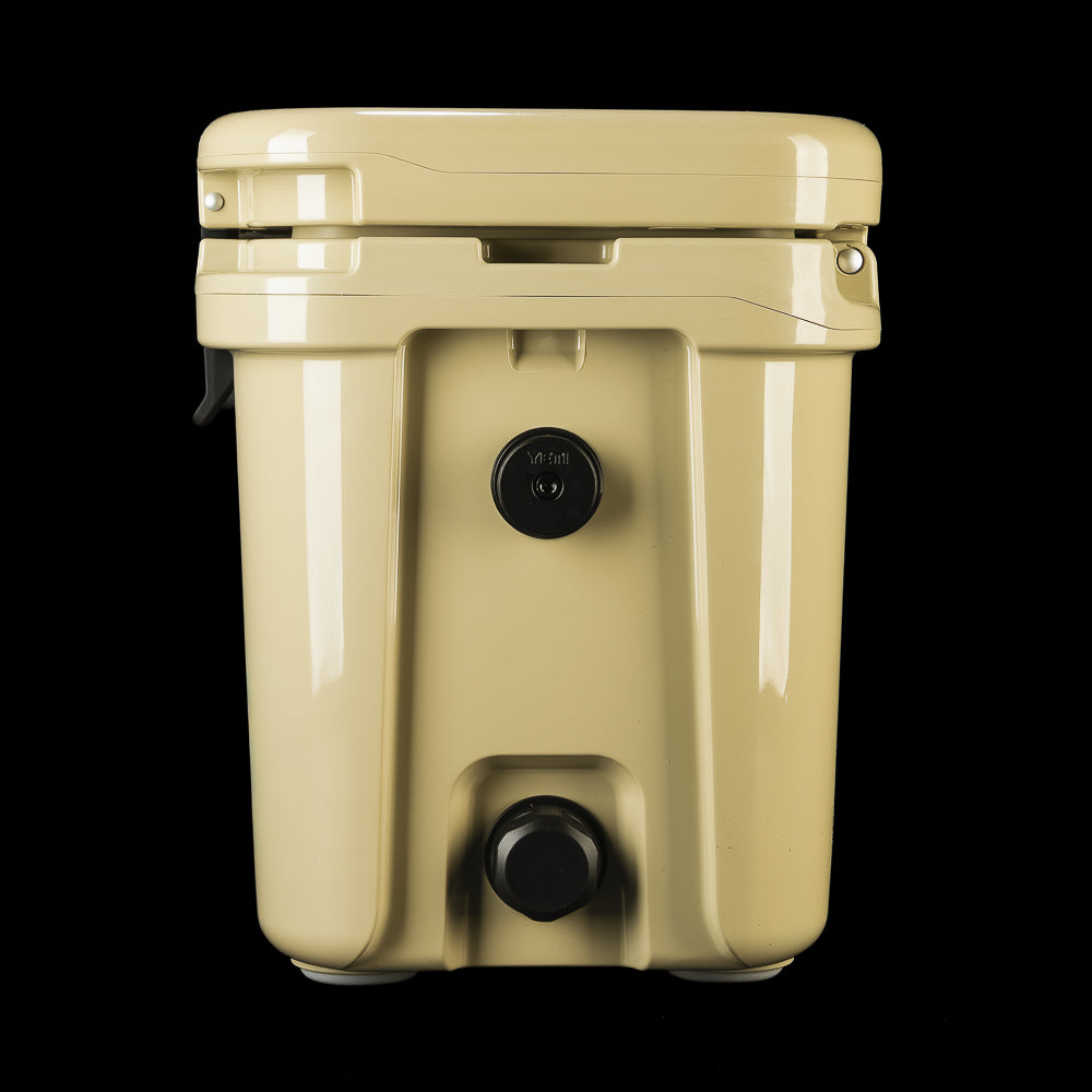 Side view of the SWAG Golf x YETI hard cooler highlighting the drain plug and molded construction.