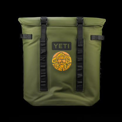 SWAG Golf x YETI Hopper M20 backpack soft cooler in olive green featuring the Swag Thing graphic, YETI logo, and MagShield closure.