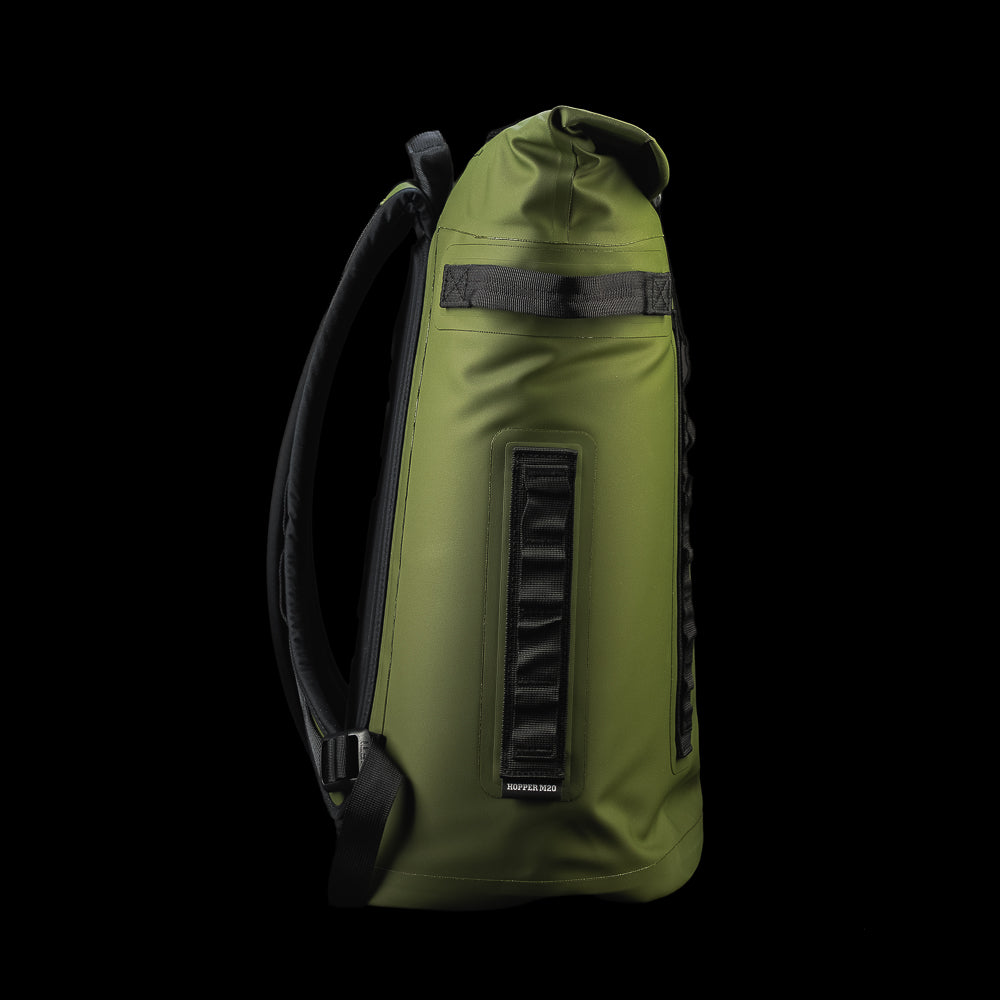 Side profile of the SWAG Golf x YETI Hopper M20 backpack soft cooler highlighting the slim design, shoulder strap, and durable construction.