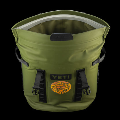 Top view of the SWAG Golf x YETI Hopper M20 backpack soft cooler showing the insulated interior and Swag Thing artwork on the front.