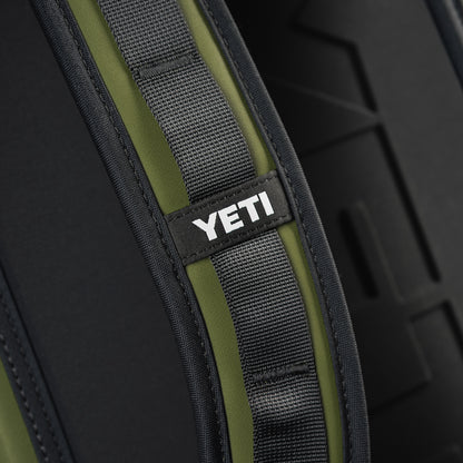 Close-up of the SWAG Golf x YETI Hopper M20 backpack soft cooler shoulder strap showing padded construction and YETI branding.