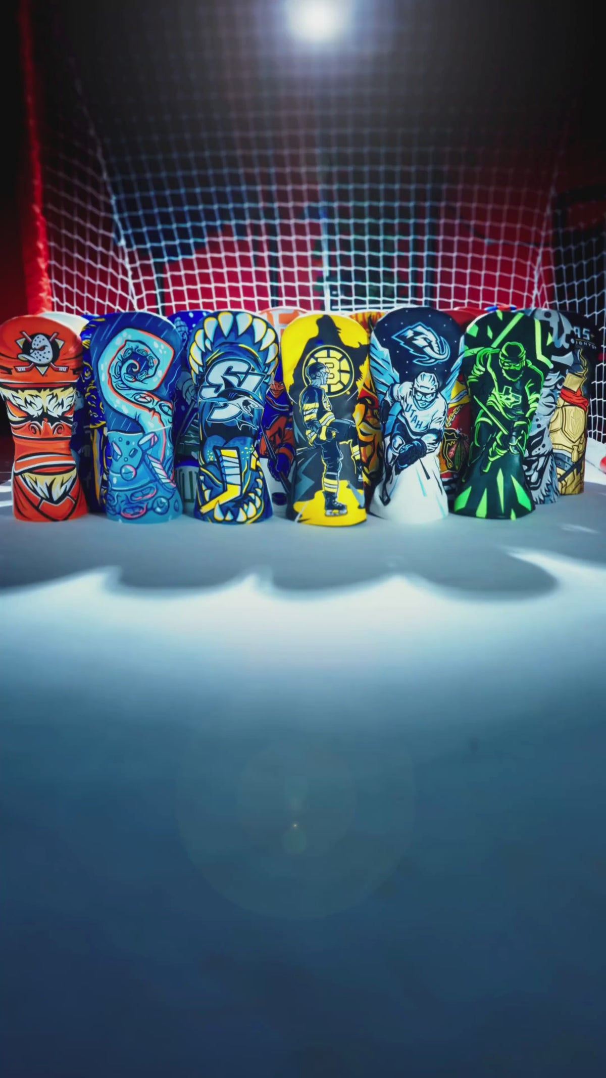 Load video: SWAG Golf x NHL official collection featuring headcovers for all US and Canada hockey teams. Hockey rink setting featuring Chicago Blackhawks, Boston Bruins, Detroit Red Wings, and New York Rangers driver covers.