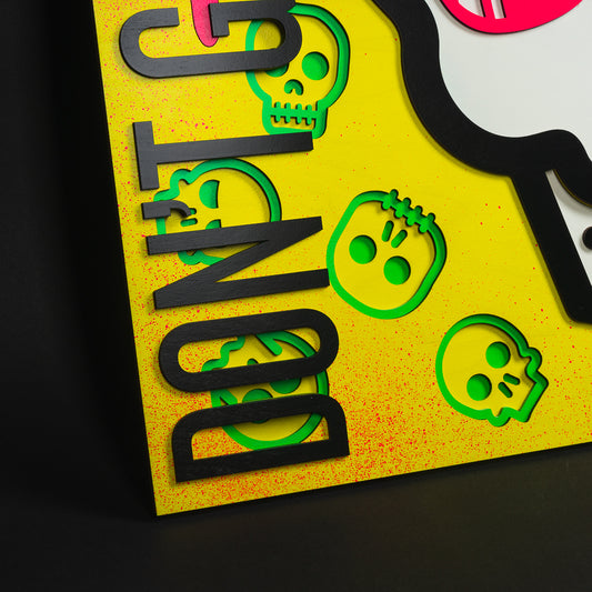 Swag x Andre Kaut Designs cnc baltic birch wood art panel featuring the signature Swag Don't Give A Putt skull with yellow, pink and green accents.