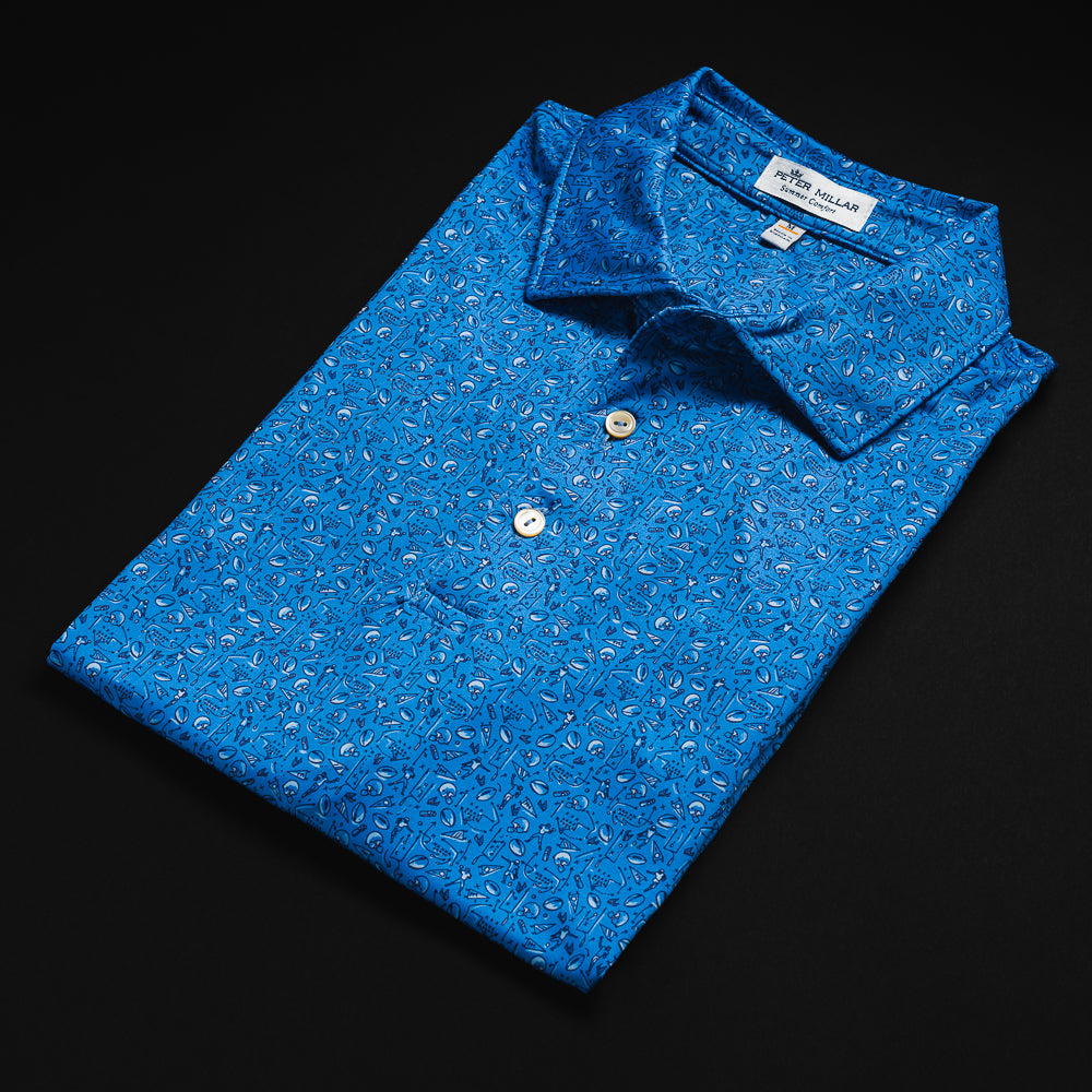 Peter Millar x Swag blue men's golf polo shirt with a football themed print and number 1 fan embroidered foam hand on the sleeve.