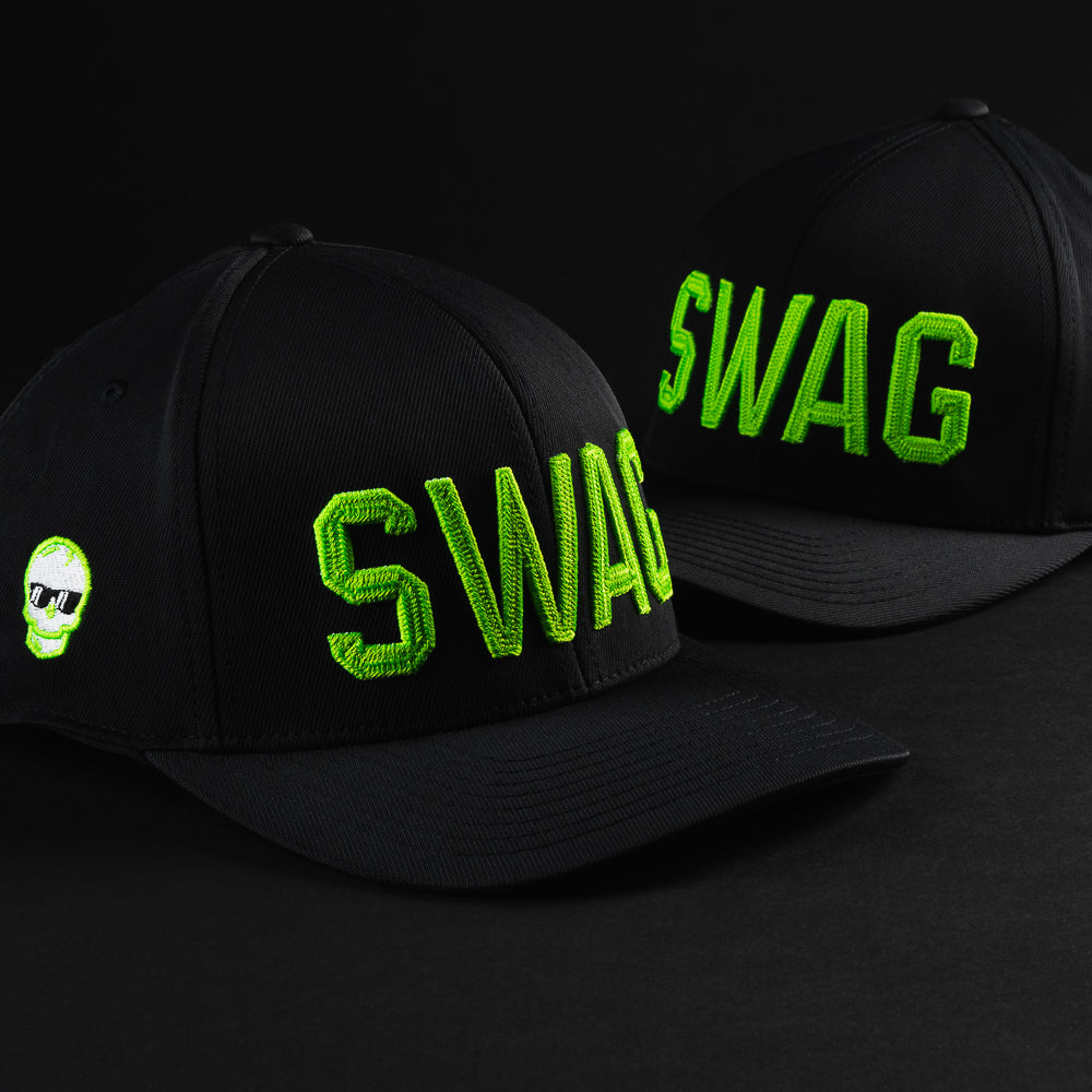 Swag x G/Fore black men's golf snapback hat with green letters and an embroidered skull on the right side.