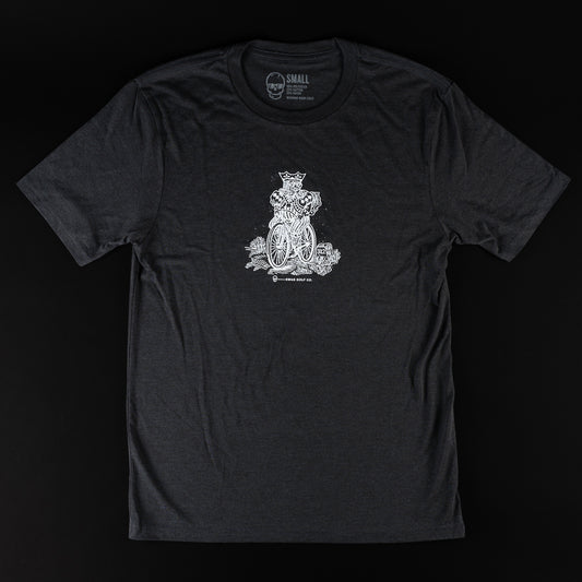 Swag black t-shirt with white graphic of a king riding a bicycle.