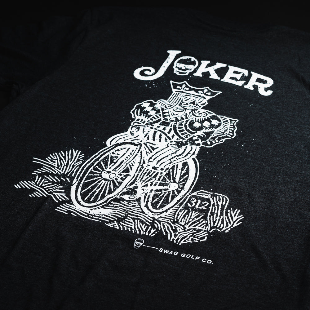 Swag black t-shirt with white graphic of a king riding a bicycle.
