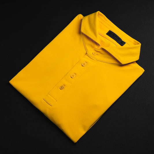 Swag x G/FORE yellow men's slim fit short sleeve golf polo shirt with Augusta Swag script logo on sleeve.