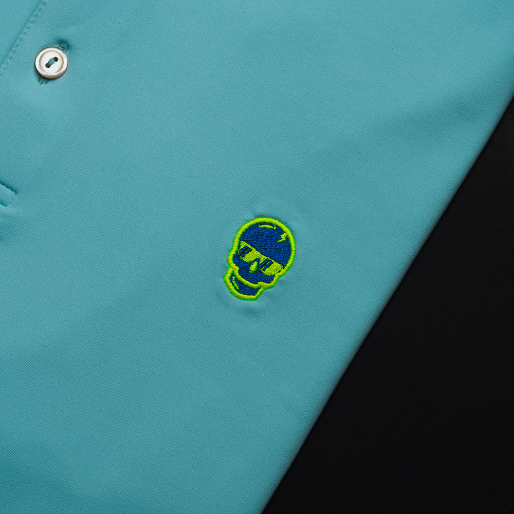 Swag x Peter Millar mint charged up men's short sleeve polo golf shirt with embroidered skull on left chest.