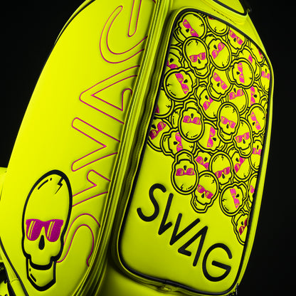 Swag x Vessel tour staff neon yellow golf club bag with stacked pink skulls.