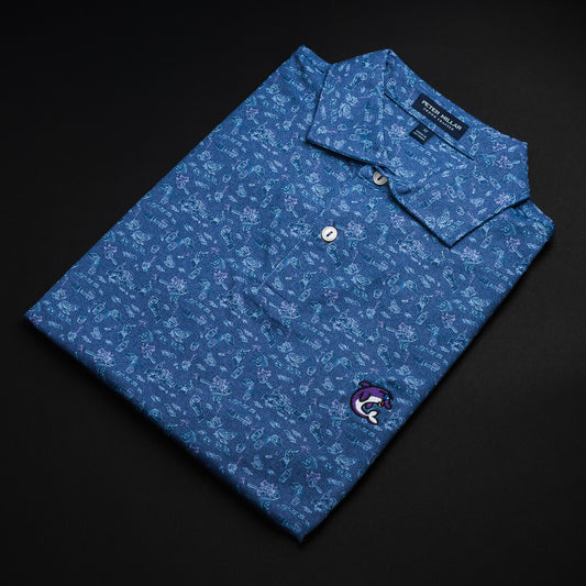 Swag x Peter Millar blue poker print men's short sleeve golf polo shirt with an embroidered purple dolphin on the left chest.