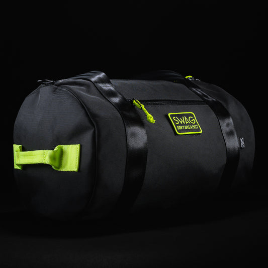 Swag x DEFY ultimate overnighter black duffel bag with yellow accents.