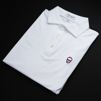 Swag x Peter Millar white men's short sleeve golf polo shirt with an embroidered skull logo on the left chest and skull shaped buttons for added flair.