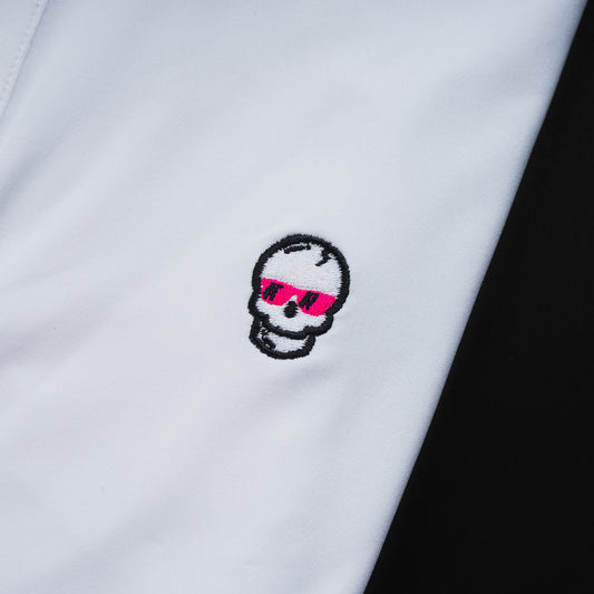 Swag x Peter Millar white men's short sleeve golf polo shirt with an embroidered skull logo on the left chest and skull shaped buttons for added flair.