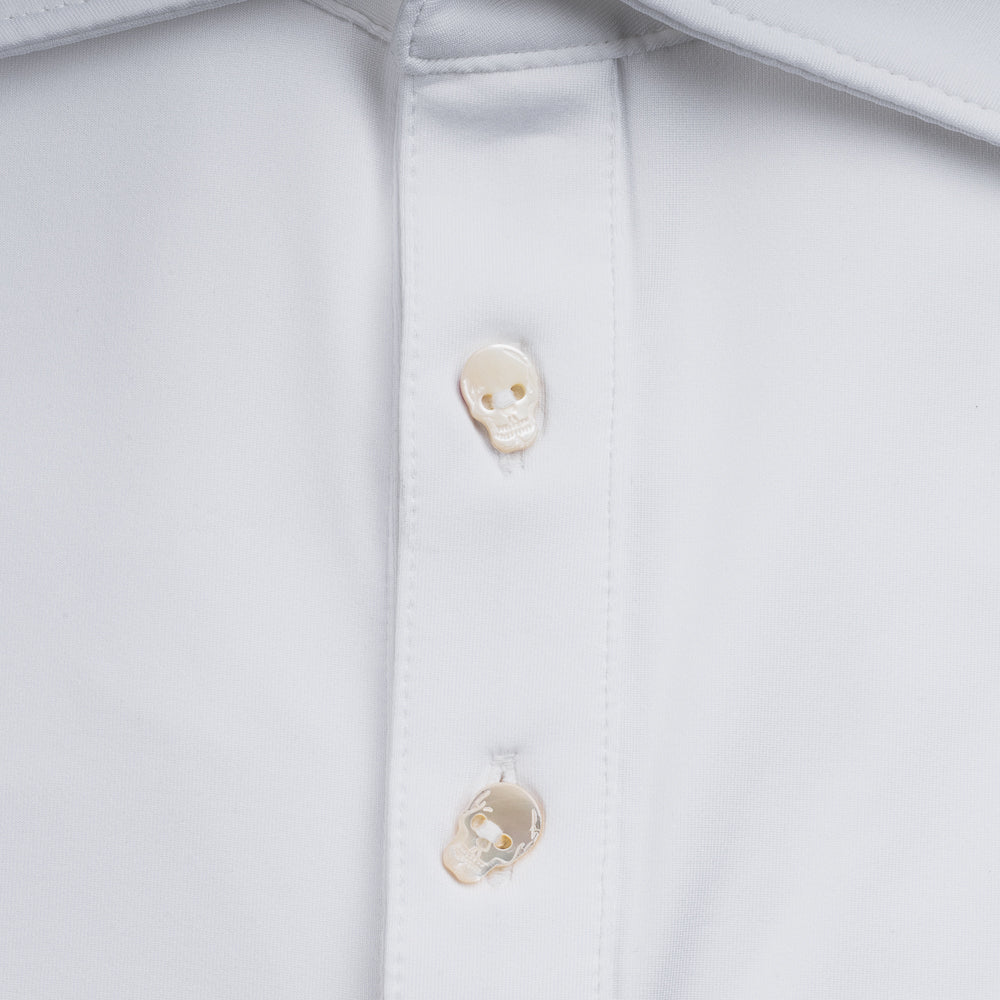 Swag x Peter Millar white men's short sleeve golf polo shirt with an embroidered skull logo on the left chest and skull shaped buttons for added flair.